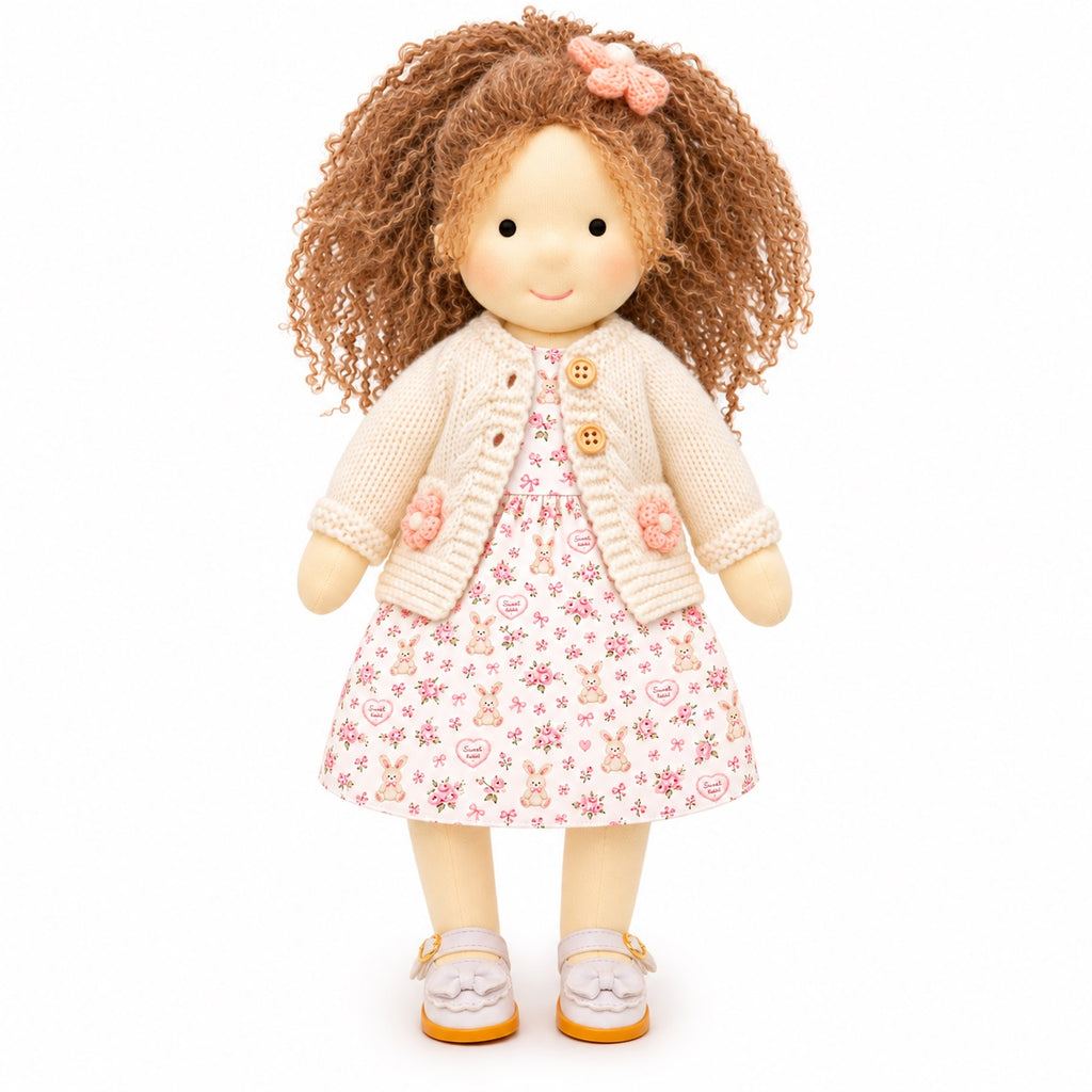 BlissfulPixie 12-Inch Waldorf-Style Doll with Brown Curly Hair, Pink Bow Hair Clip, Cream Knitted Cardigan, Bunny Print Dress & White Mary Jane Shoes – Cute Gift for Kids
